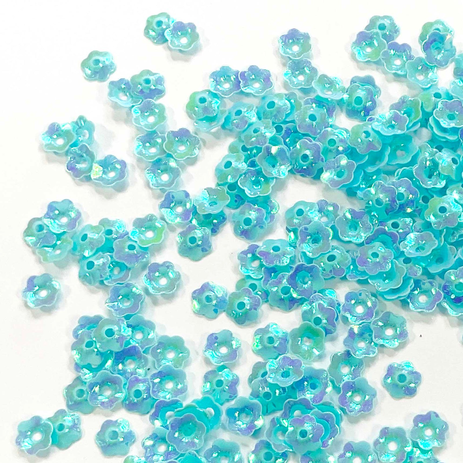 www.colourstreams.com.au Colour Streams Sequins Embellishments Costumes Mardi Gras Dancing Ballet Theatre Shows Drag Queen Bling S101 Opaque Flower Shape Pale Blue Lights Blues Mauves Iridescent Reflections Shiny 6mm