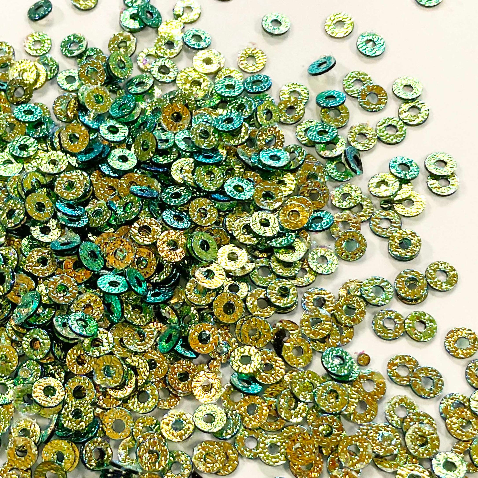 www.colourstreams.com.au Colour Streams Sequins Embellishments Costumes Mardi Gras Dancing Ballet Theatre Shows Drag Queen Bling S107 Flat Circle Shape Textured Green Gold Lights Iridescent Reflective Shiny Golds Greens 3mm